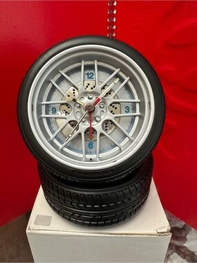 Novelty Tire Wheel Clock – Silver and Black with Red Second Hand